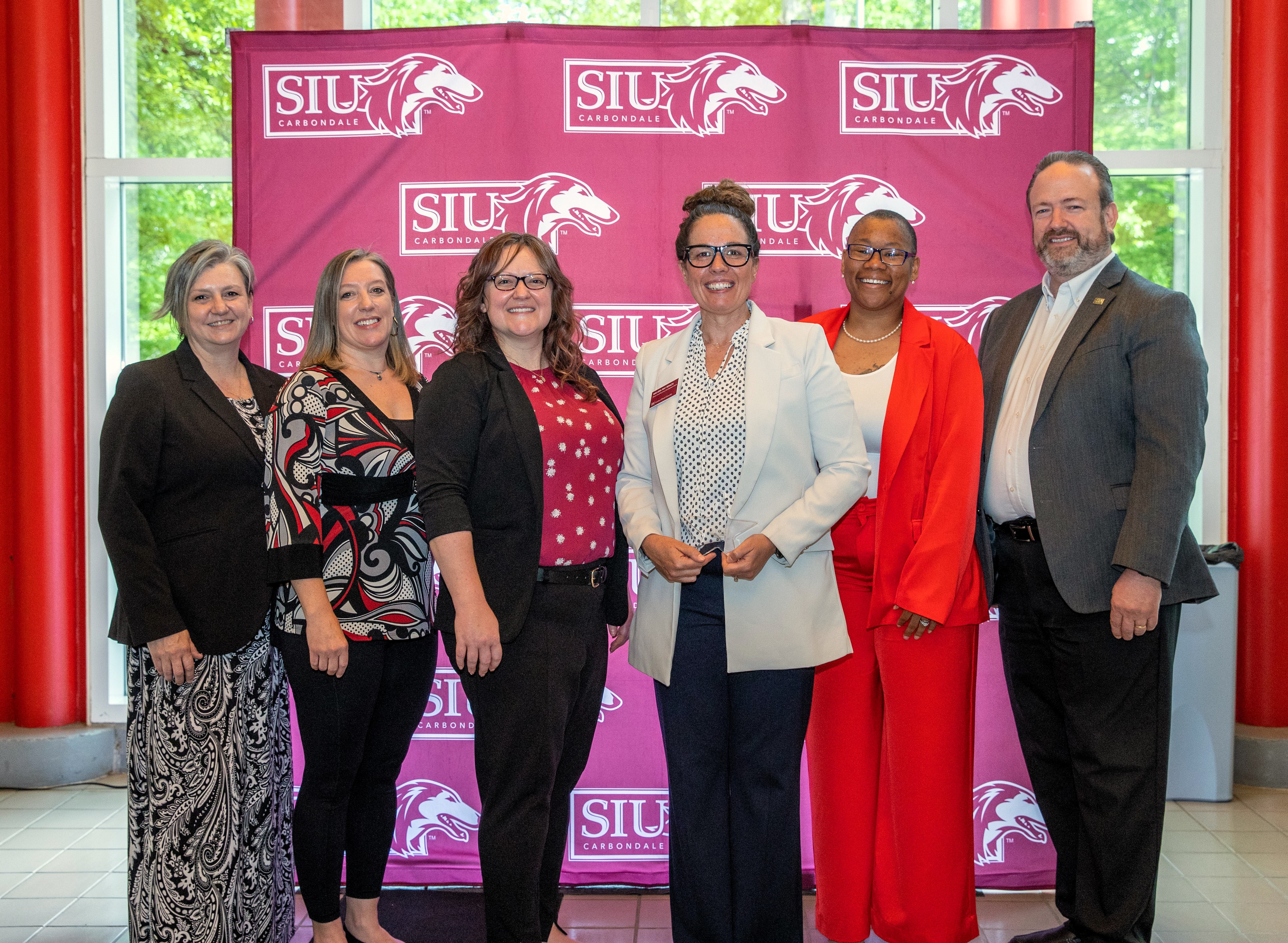 The Illinois SBDC Staff with State Director Ericka White during an award presentation.
