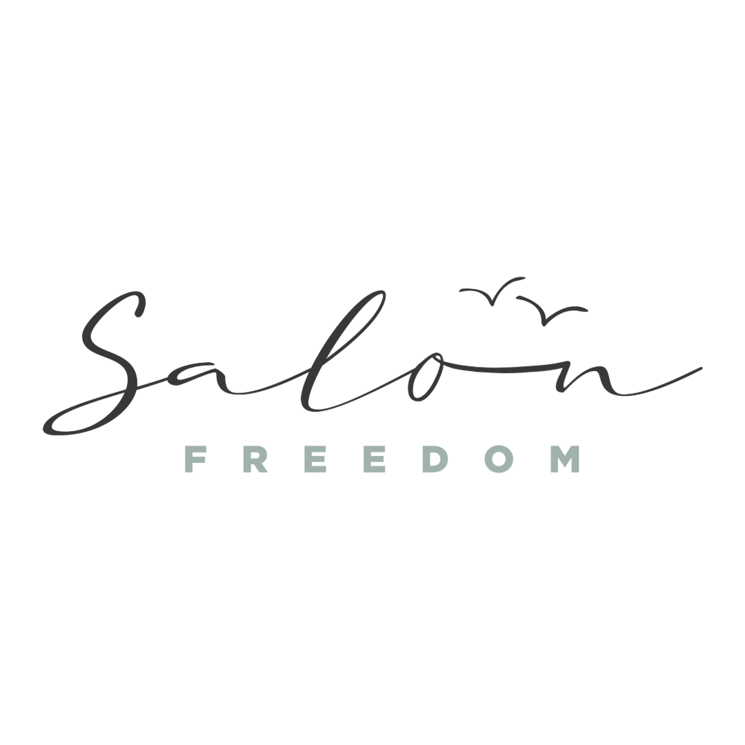 Salon Freedom logo. Salon is in black script over the word Freedom in turquoise block letters. There are two small v's representing seagulls over the word Salon. 