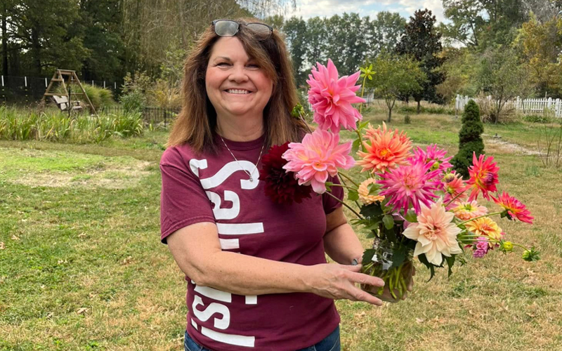 Mary Keller with flowers from garden